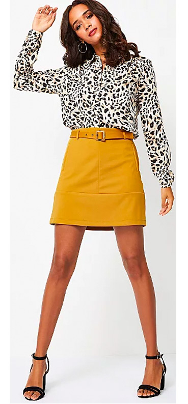 Our Mustard Square Buckle Belted A-Line Skirt has a self-tie square buckle waist belt