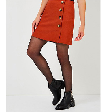 A combo of Chelsea boots and a skirt makes for a stylish and sophisticated look