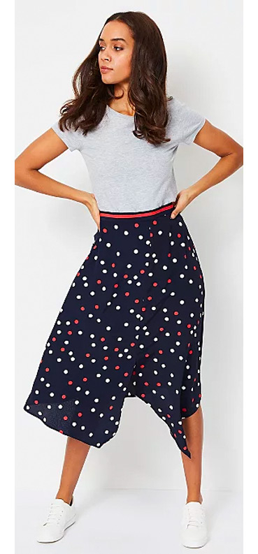Make a colour statement with this asymmetric midi skirt, coming in navy with an all-over polka dot print