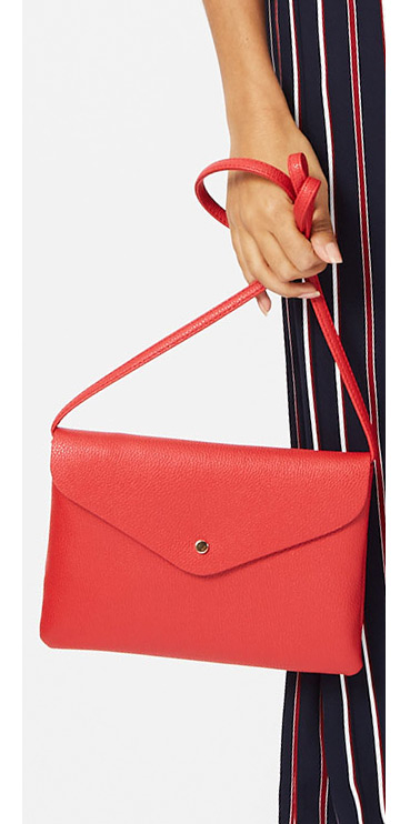 Go for a more minimalistic look with this gorgeous cross-body bag, coming in a red hue with a single stud