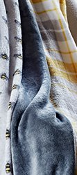 A close up of white, blue and yellow fabric
