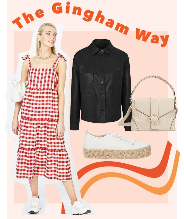 Woman poses wearing red and white gingham check midi dress, cream shoulder bag and white trainers. Cut outs of black faux leather shacket, beige buckle stitch detail cross body bag and white jute sole canvas shoes.