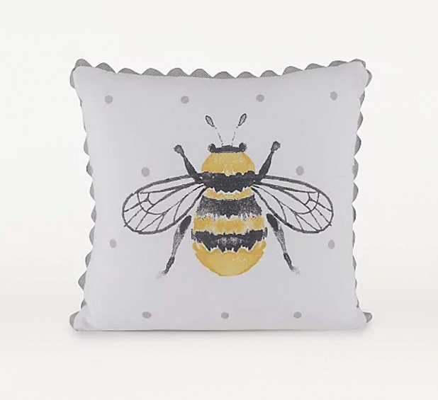 White cushion with grey spots, large bumblebee graphic and grey scallop trim.