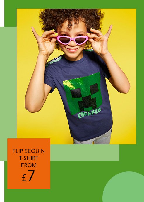 A girl wearing a navy and sequin Minecraft Creeper t-shirt and pink sunglasses.