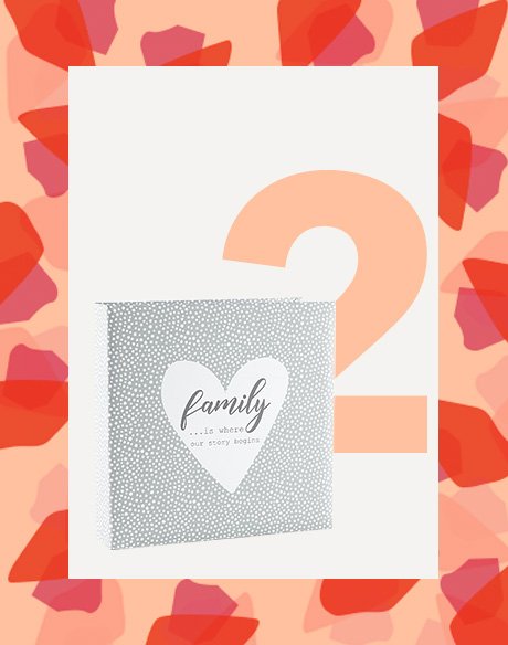 Silver-effect dotty photo album with family lettering.
