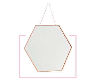 Add the finishing touch to the room with a hexagonal mirror