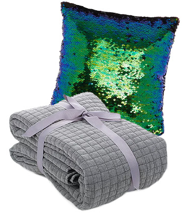 Accessorise with a grey throw and sequin cushion