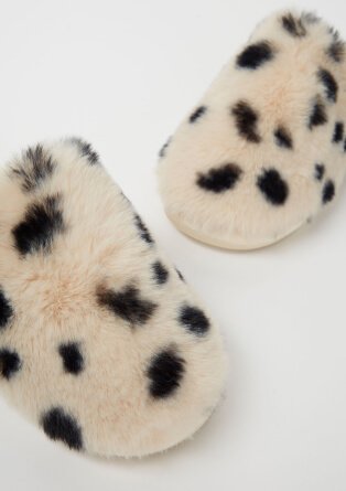 Cream and black spotted slippers.