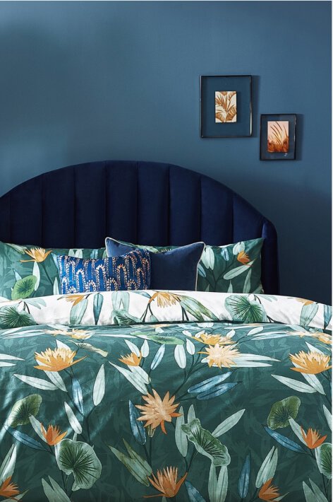 A green and orange floral bedding set.