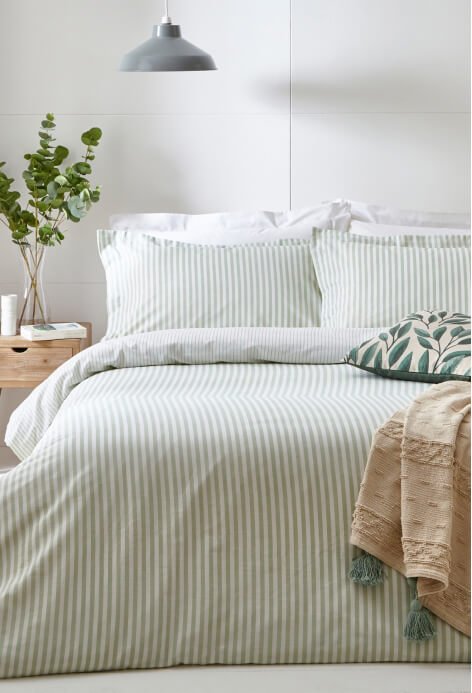 A green and white bedding set.