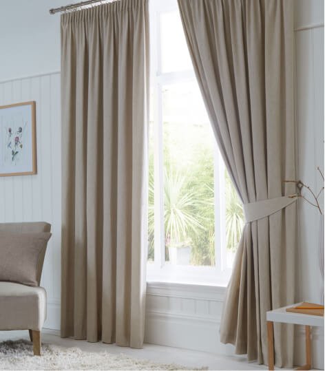 Neutral coloured curtains.