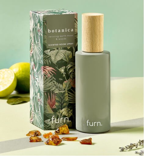 Botanica scented room spray in a green bottle.