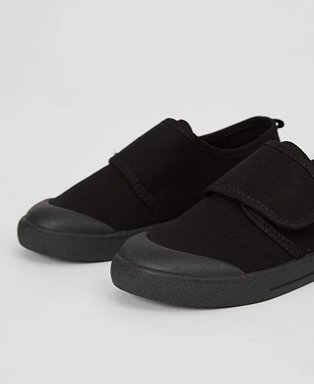 Black non-marking sole plimsoll school pumps.