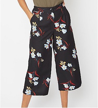 Woman wearing black floral straight leg culottes