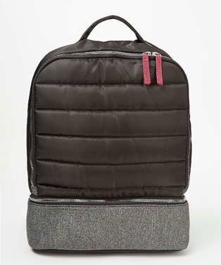 Black quilted grey panel backpack.