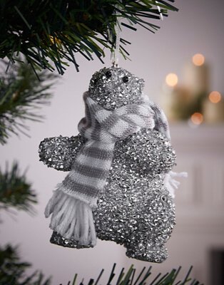 Silver glitter polar bear bauble with grey and white scarf.