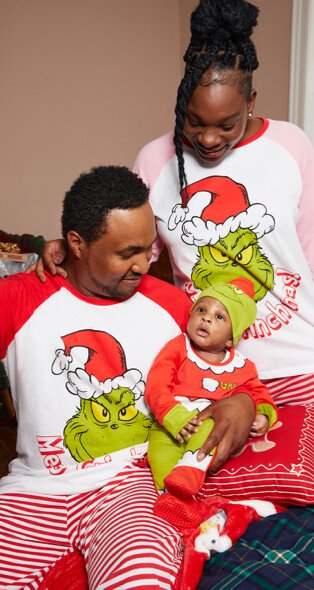 Family wearing matching Grinch Christmas Pyjamas.