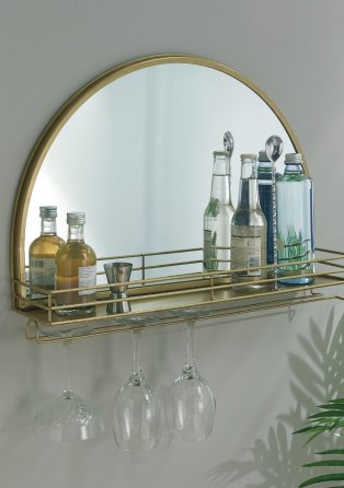 Gold-tone shelf with assortment of drinks and glasses.