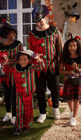 A family of four wearing coordinated clown costumes.