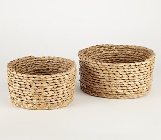 Two circular wicker baskets