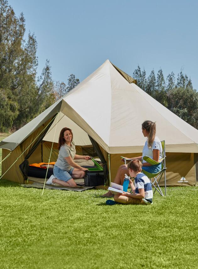 A family using an Ozark Trail Olive Green Yurt Tent 8 Person.