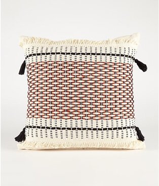 White patterned cushion with tassles