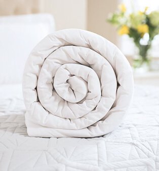 White duvet rolled up