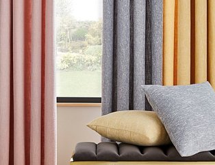 Hanging curtains in pink, grey and yellow