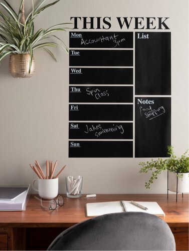Black chalk memo board wall sticker above a wooden desk and office chair.