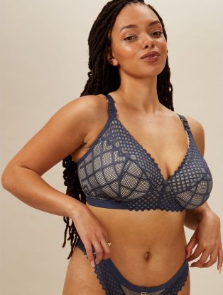 Woman wearing grey bra and knicker set.