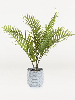 Artificial palm plant in grey decorative pot.