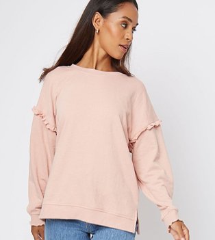 Woman in pink oversized jumper