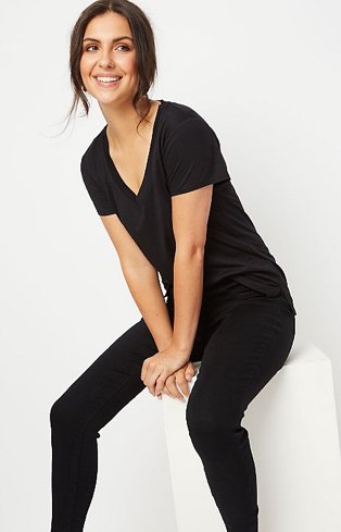 Woman in black t-shirt and black jeans