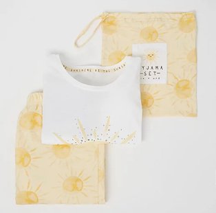 White and yellow sunshine print pyjamas with bag.