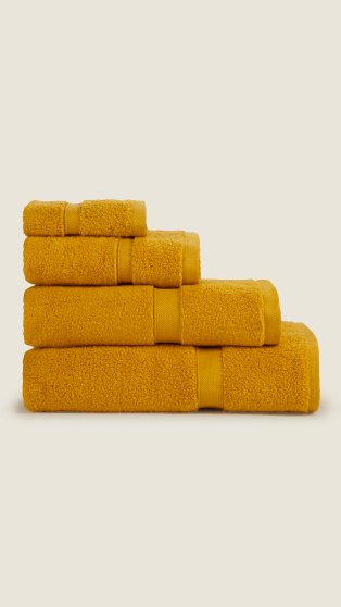 A stack of folded yellow towels.