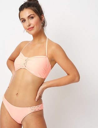 Woman wearing a dusty pink matching bikini set