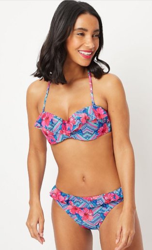 Woman wearing a light blue and pink floral patterned matching bikini set
