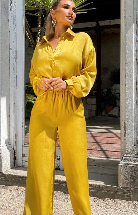 A woman wearing a yellow jumpsuit.