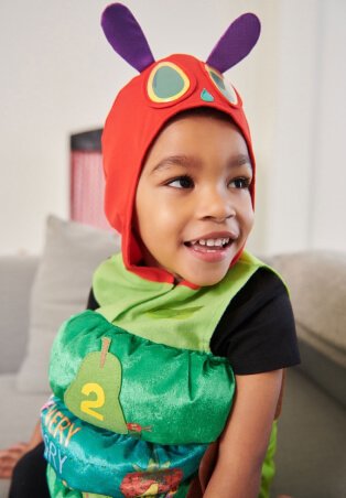 Child wearing caterpillar dress up costume.