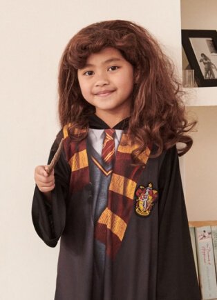Child wearing Harry Potter costume.