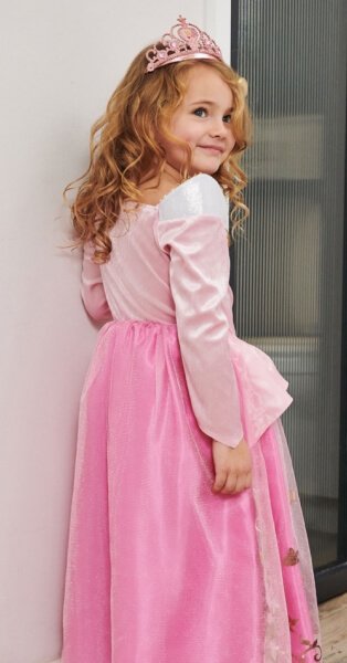 Child wearing princess dress.