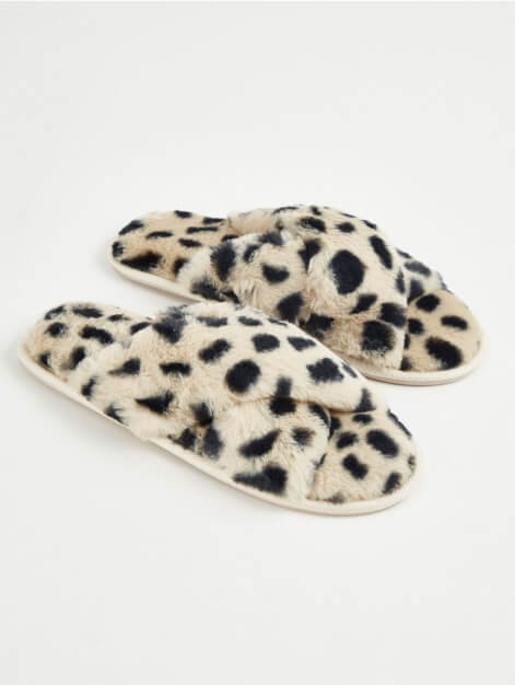 Cream spotty slippers.