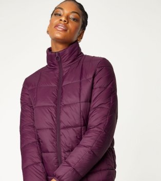 Woman wearing purple puffer jacket.