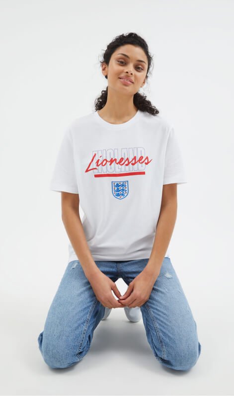 A woman wearing a Lionesses t-shirt.