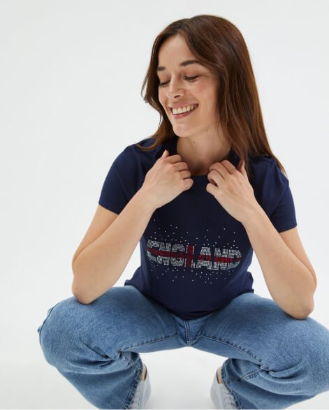 A woman wearing an England football t-shirt.
