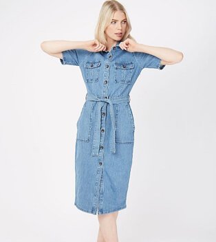 Woman wearing a blue denim button down midi shirt dress