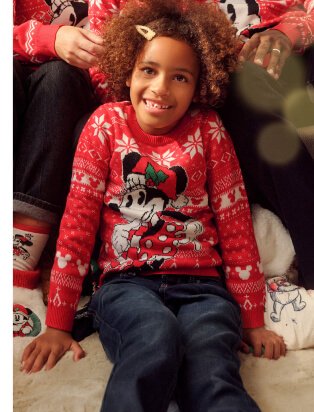 Child wearing Disney Minnie Mouse Jumper.