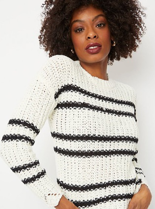 Woman in white stripe scallop hem jumper