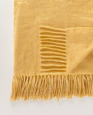 Mustard yellow tassel throw