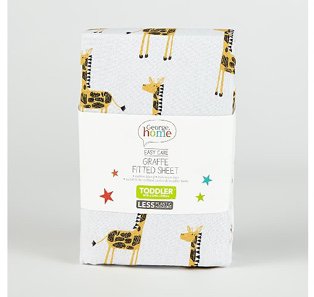 A white giraffe fitted sheet for a toddler bed